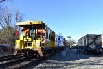 Chessie System Caboose # 904059 and Conrail Caboose # 22130 both on the rear of the TFT train in Rochelle Park while gifts are being distributed to the crew